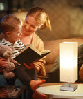 Cozy Minimalist Table Lamp For Bedroom Bedside Nightstand With Square Fabric Shade, Desk Reading Light For Kids Room Living Room Or Office, White Shade And Silver Base, UL Listed, beside a mother reading to child