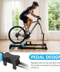 Cyclist using Detachable Indoor Bike Resistance Trainer With Quick Release Front Wheel No-Slip Balance Rack in home gym