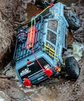 RC truck with Beefy One Tenth RC Scale ABS Fuel Tank for Axial Wraith SCX10 Exo AX10 Trucks Pack Of 2 in muddy terrain