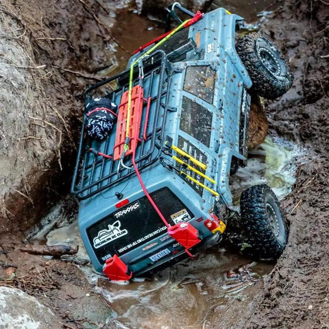 RC truck with Beefy One Tenth RC Scale ABS Fuel Tank for Axial Wraith SCX10 Exo AX10 Trucks Pack Of 2 in muddy terrain