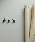 Set Of 3 Hand Gesture Wall Hooks, rustic cast iron decor with playful hand gestures on a wall, 4 inch metal coat rack.