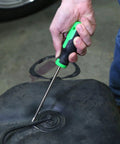 OEMTOOLS 26519 hose remover tool, green and black handle, used to remove coolant hose from a vehicle reservoir.