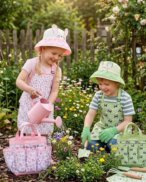Two kids gardening with Eight Piece Kids Gardening Tool Set With Shovel Rake Watering Can Hat Apron Gloves And Storage Bag Pink Flower Theme