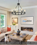 Black Wagon Wheel Chandelier, 6-Light Rustic Modern Farmhouse Pendant For Dining Room Over Table in a cozy living room setting.