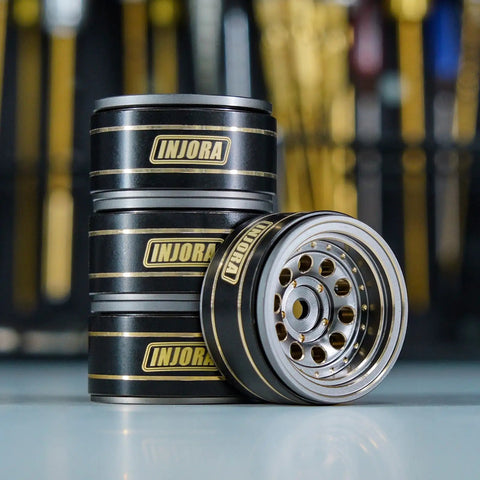 Beadlock Wheel Rims For 1/24 And 1/18 RC Crawlers, Brass Weight, Black Coated, stacks and one rim angled for view.