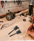 Spare Tire Mounting Bolt Kit Bolt On Spare Tire Hold Down for HRV cars on a workbench showing installation setup