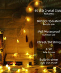 Globe String Lights 60 LED Battery Operated With Remote 26ft Waterproof Indoor Outdoor Fairy Lights on bookshelf