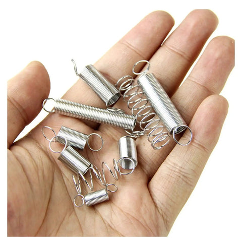 Hand holding assorted springs from Heavy Duty Compression Spring Set 200 Pcs Stainless Steel Hardware Kit With Zinc Plated Coils