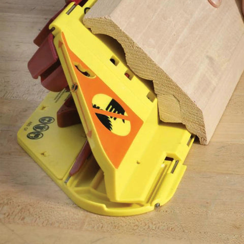 Crown Molding Cuts Made Super Easy With This Solid Miter Saw Jig positioned with trim for 38 degree angle cuts.