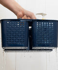 Portable Shower Caddy Organizer With Handle And Three Compartments Offers Zero Hassle Organization With Fast Draining Design, shown in use with water.