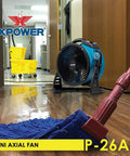 Industrial Axial Air Mover With Built In Power Outlets for water damage restoration and home use shown on office floor