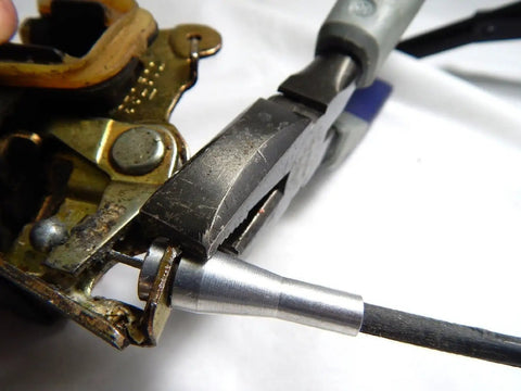 Close-up of Ford 16 Ends Latch Lock Cable Repair Kit for Vehicle Doors Fits F Series E Series Ranger Expedition in use.