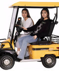 Kick Back And Roll With This Hella Durable Electric Golf Cart Featuring A Robust 800 Watt Motor Roomy Cargo Hold And Extended Mileage For Carefree Adult Day Trips Around Town with two women seated.