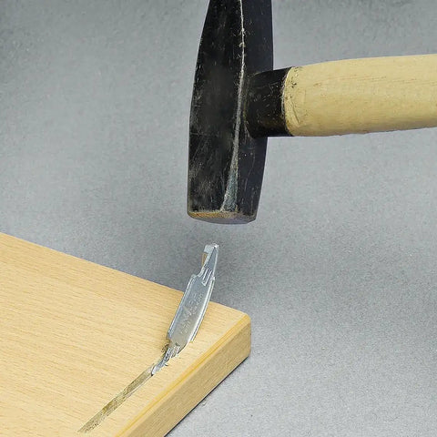 Hammer inserting Silver Biscuit Connector Set Size 20 Die Cast Wood Joiner for Invisible Joints in hardwood.