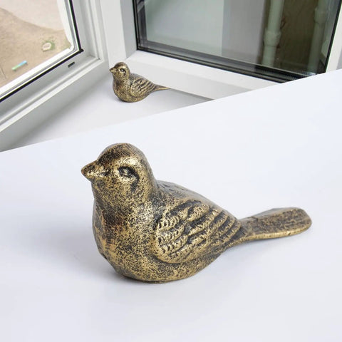 Cast Iron Bird Door Stopper Set 2 Heavy Duty No Drill Floor Door Stops with Handle Antique Bronze Finish for Office Home Bedroom and Exterior Doors Rustic Vintage Decor, close-up view of bird-shaped stopper on floor.
