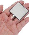 MECCANIXITY thin-film pressure sensor FSR406B, 20g–10kg, silver square film with interdigitated traces held in hand