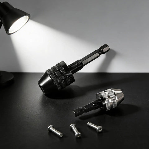Two Pack Keyless Drill Chuck Adapter Set With One Quarter Inch Hex Shank for Impact Drivers on black surface with screws