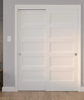 Installed Richelieu Hardware 14660BC 60 Inch Bypass Door Hardware Kit with zinc and brass finish on white panel doors