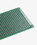 Close-up of a PCB from the 32 Piece Double Sided PCB Board Prototype Kit For DIY Soldering With Five Size Options Compatible With Arduino Projects