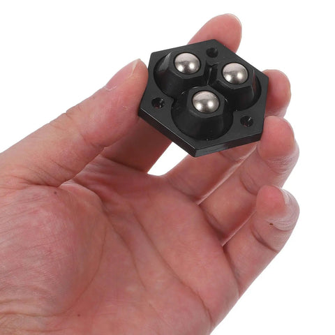 Person holding a mini caster wheel from 4 Pack Mini Swivel Caster Wheels With Self Adhesive Base For Storage Boxes And Office Equipment Silent No Drill Install Durable Abs And Steel Balls Easy Gliding Mobility For Home Use
