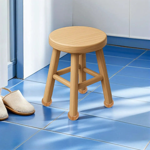 Small wooden stool on blue tiled floor next to slippers.