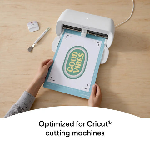 Hands using a Joy Xtra machine with Heat Transfer Paper For Light Tees 20 Sheets 8.5x11 Printable HTV Iron On For Inkjet Printers.