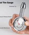 Hand holding dial tire gauge from 16 Piece Air Compressor Accessory Kit With One Quarter Inch Recoil Polyurethane Air Hose 23 Foot.
