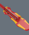 Close-up of Kraftform Kompakt VDE 17 Universal 1 Set with anti roll handle showcasing ergonomic design and vibrant red-yellow color.