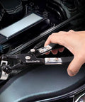 Close-up of hand using Toolwiz Clic-R plier from Four Piece Radiator Hose Clamp Pliers Set With Long Reach 27 Inch Wire Spring Flat Band Remover And Clic R Type Hand Tools For Automotive cooling Systems in engine bay