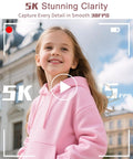 Young girl smiling outdoors in pink hoodie, showcasing the 5K 75MP Autofocus Vlogging Camera With WiFi And 64GB Card Included 180 Degree Flip