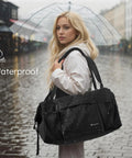 Woman carrying Mens Gym Bag With Shoes Compartment And Wet Pocket Convertible Duffle Bag And Backpack Waterproof Sports Bag For Men