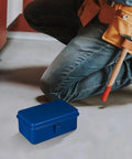 Premium Badass Heavy Duty Steel Toolbox With Secure Locking Lid For Garage Workbench And Car Trunk Storage, blue color, on the floor.