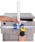 Cabinet Hardware Jig For Handles And Knobs in use, aligning drill guide sleeve with a drawer using an electric drill.
