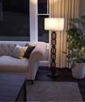 Tall Black Floor Lamp With White Rectangular Shade, 59.5 Inch Height, beside a sofa in a cozy living room setting