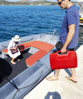 Man carrying Portable Boat Gas Tank 3 Gallon 12L With Transfer Hose And Gauge for outboard engine near fishing boat