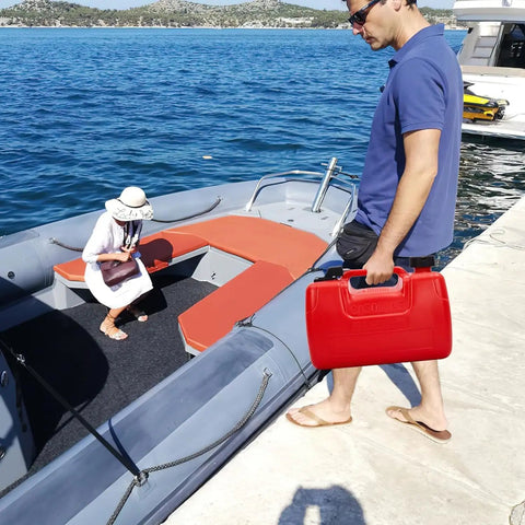 Man carrying Portable Boat Gas Tank 3 Gallon 12L With Transfer Hose And Gauge for outboard engine near fishing boat