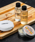Must Have Cutting Board Care Kit With Wood Cutting Board Oil Soap Wax Buffing Pad And Food Grade Mineral Oil Gift Set displayed on board