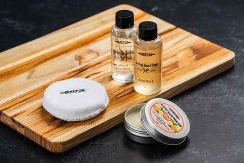 Must Have Cutting Board Care Kit With Wood Cutting Board Oil Soap Wax Buffing Pad And Food Grade Mineral Oil Gift Set displayed on board