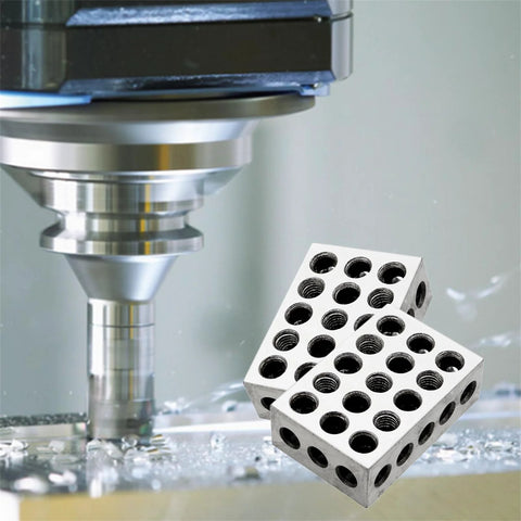Angled view of a pair of 1x2x3 inch steel parallel blocks with 23 threaded holes