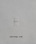 Small nylon hinge for RC airplane models, part of 16 pack durable fixed wing hinge set for aileron, rudder, and elevator.