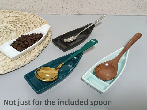 Boat Shaped Coffee Spoon Rest With Turquoise Accent And Matching Mini Spoon Cute Dope Coffee Bar Accessory For Your Coffee Station Or Tea Setup Holds Teaspoon Keeps Counter Clean 1 Piece shown with multiple spoons and coffee beans.