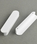 Matte White Kitchen Cabinet Handles Pack Of 5 Cup Pulls on gray background, showing two sleek handles, 3.8 inch center to center, 4.7 inch long.