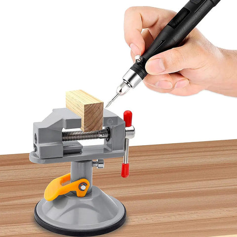 Person using Dope Mini Drill Press Vise With Suction Cup 360 Degree Rotating Walnut Clamp Adjustable Jaw Vise for woodworking on table.