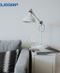 Living room with Durable No-Fuss Decorative Receptacle Wall Plate 1-Gang Standard Size Decorator Covers on wall next to lamp and sofa