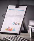Letter Size Non Magnetic Copyholder with Removable Line Guide and Adjustable Easel Back on a desk with papers.