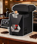 Commercial Grade Electric Coffee Bean Roaster For Home Baristas 200G Compact Countertop Roasting Machine on a kitchen counter with coffee beans.