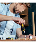 Man using Top Notch 43 Pcs Magnetic Screwdriver Kit Slotted Phillips Hex And Torx Bits Perfect For Delicate Electronic Fixes Serious DIY Work And Pro Jobs To Get It Done Flawless Total Game Changer For Any Toolbox on wood repair