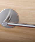 Close-up of 16 Inch Stainless Steel Towel Bar With 3M Self Adhesive Wall Mount No Drill Brushed Nickel on wooden surface.