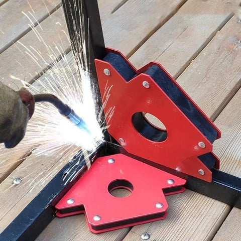 Super Strong Multi Angle Welding Magnet Set 6 Pcs For Pipe Positioning At 45 90 And 135 Degrees in use with welding sparks.