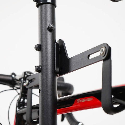 Close-up of a Freestanding Four Bike Storage Rack With Adjustable Gravity Hanger showing the bracket and bike mount.